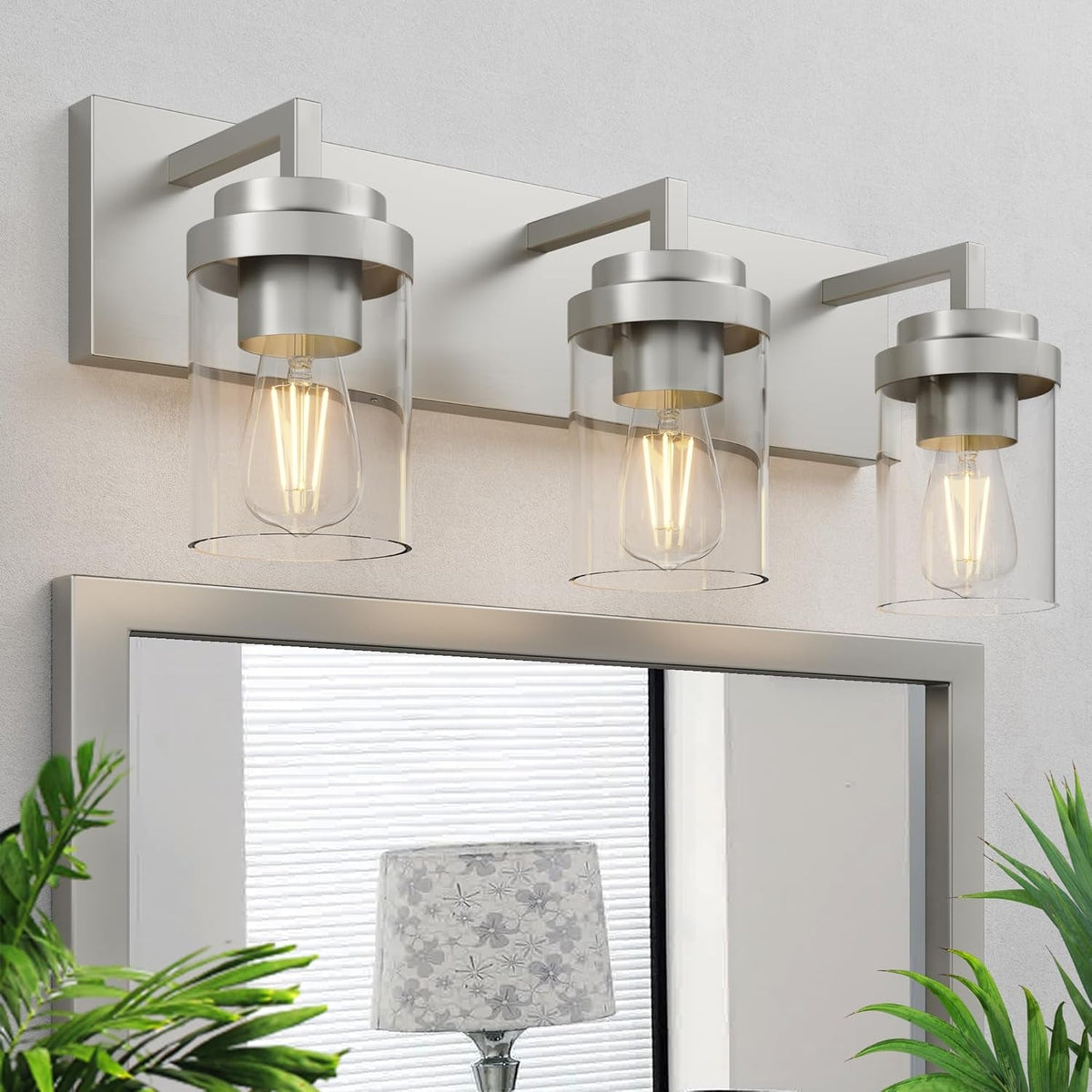 Lampada da specchio con paralume in vetro trasparente