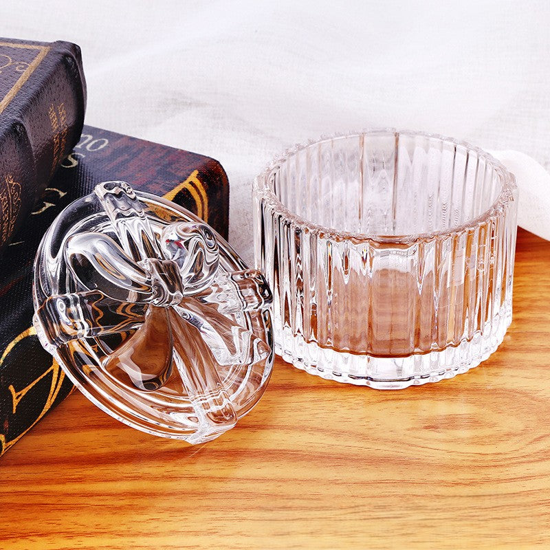 Bocal en verre nervuré rond avec couvercle sculpté à nœud
