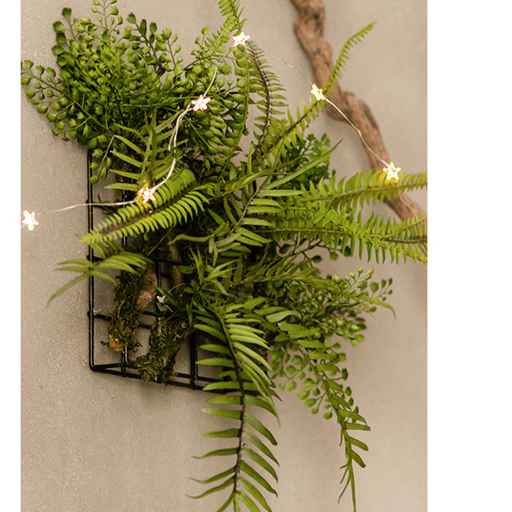 Decorazione da parete con pianta artificiale e cornice in metallo