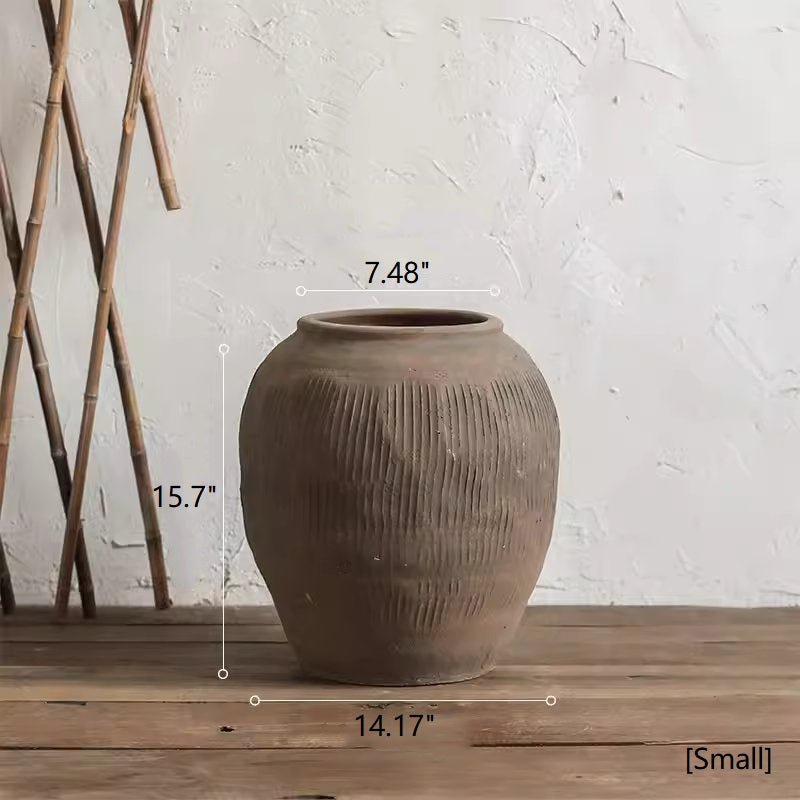 Vaso tondo in terracotta marrone