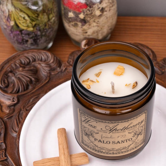 Candela botanica da 6 once in vasetto di vetro ambrato - Palo Santo
