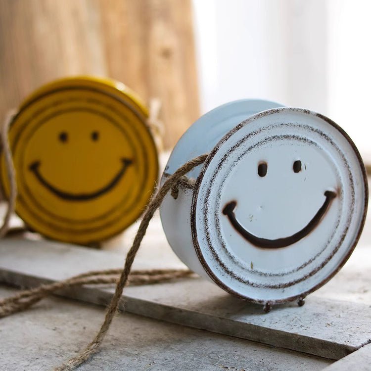 Cache-pot suspendu visage souriant