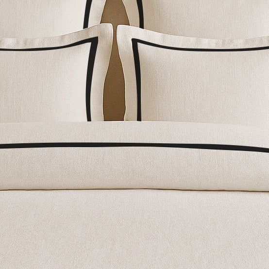 Set copripiumino in lino con bordo a cornice