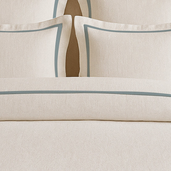 Set copripiumino in lino con bordo a cornice