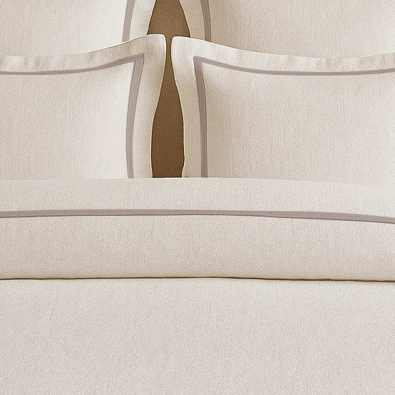 Set copripiumino in lino con bordo a cornice