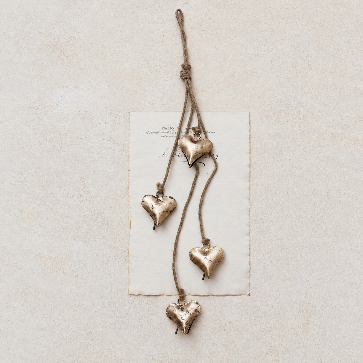 25.75" Metal Hearts on Jute Rope – Antique Brass Finish