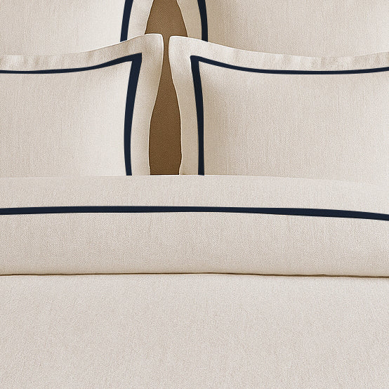 Set copripiumino in lino con bordo a cornice