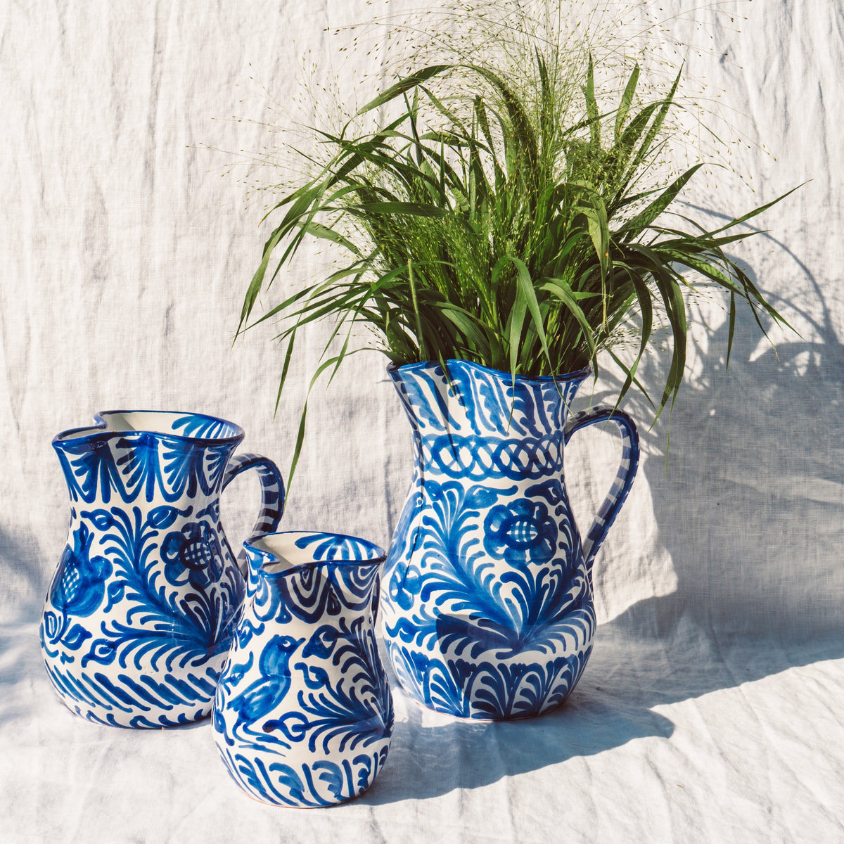Large pitcher with hand painted designs
