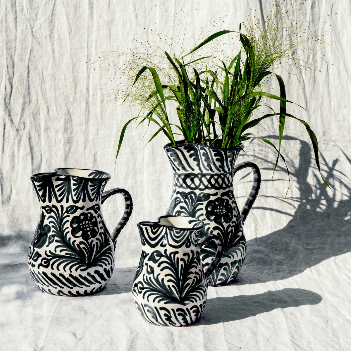 Medium pitcher with hand painted designs
