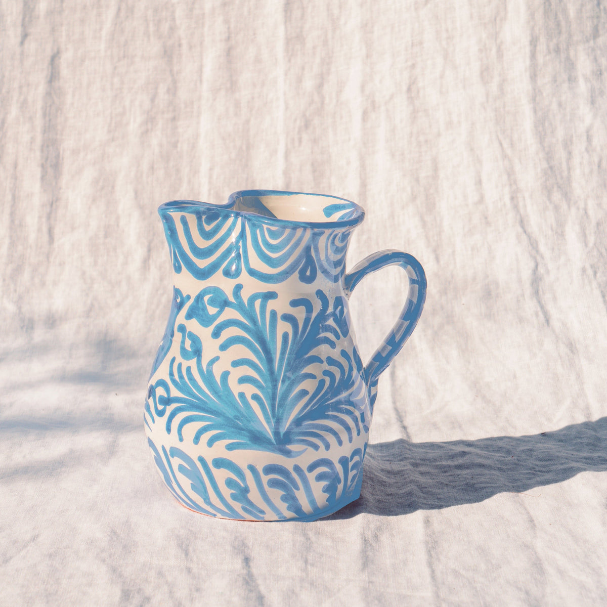 Small pitcher with hand painted designs