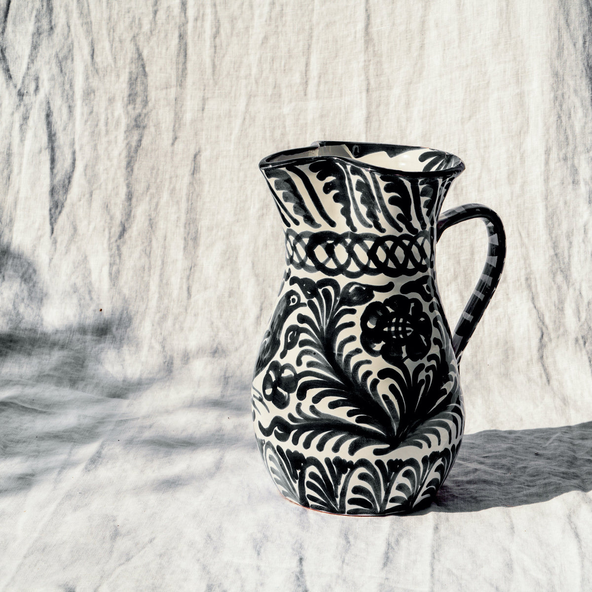 Large pitcher with hand painted designs