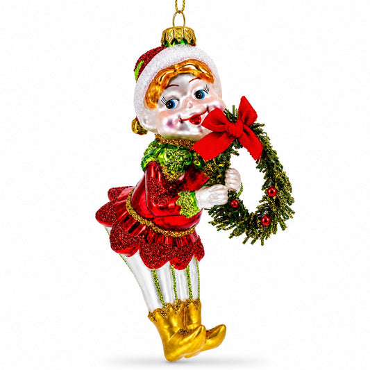 Ornement de Noël en verre représentant un elfe souriant avec une couronne à nœud rouge