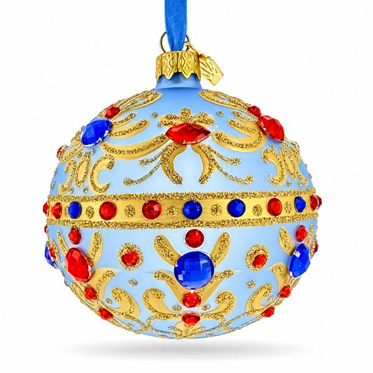 Boule de Noël en verre bleu roi avec motifs volutes et tons joyaux