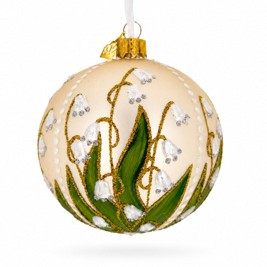 Ornement de Noël boule en verre beige avec muguet