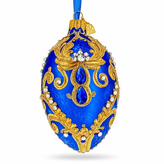 Ornement de Noël en verre bleu roi avec volutes à paillettes et bijoux