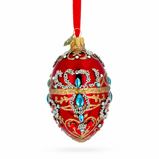 Ornement de Noël en verre en forme d'œuf avec volutes à paillettes et bijoux rouges