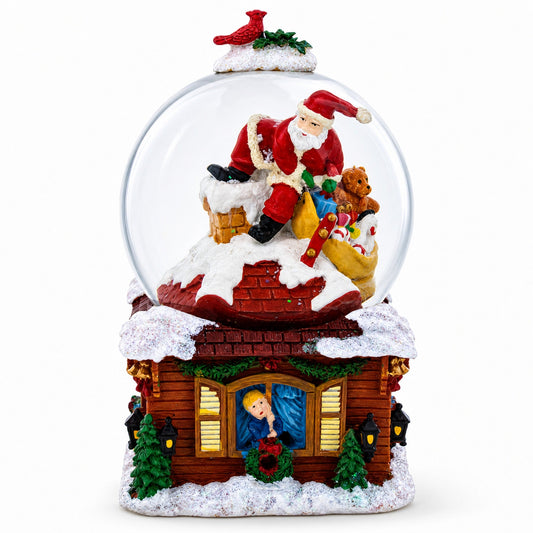 Boule à neige musicale avec Père Noël, cadeaux de Noël et cheminée